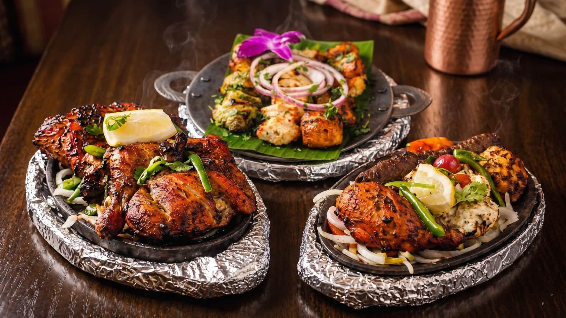 Glowing red and orange charcoal embers — raw, primal fire of ancient tandoor craft
